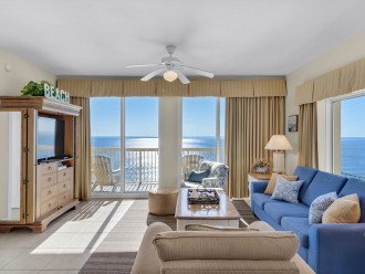 Living area has a wrap around view of the ocean, beach, Pier and Pier Park.