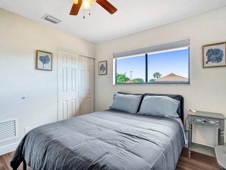 Lake and pool views abound from this queen bedroom
