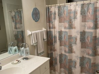Full guest bathroom with tub and shower