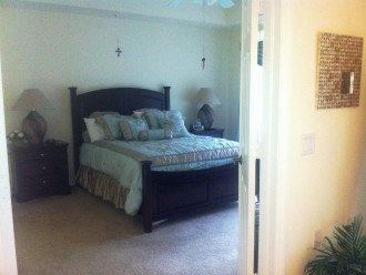 Queen sized bed in Master bedroom w/ large screen TV