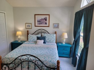 Sweet dreams await anyone who sleeps in this restful second bedroom.