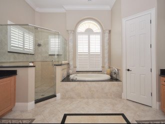 Enormous luxury en-suite bathroom with a Jacuzzi bath