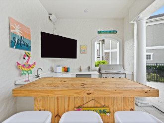 Summer kitchen with 70" TV & bar