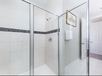 En suite bath with double vanity sins and sizable shower