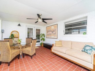 Sunroom with pool toys and comfortable couch