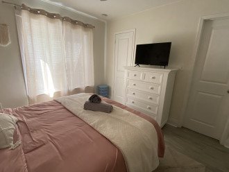 Queen bedroom offers dresser and walk-in closet