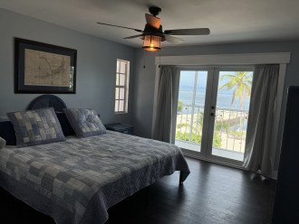 Master bedroom with unobstructed open ocean views, access to balcony