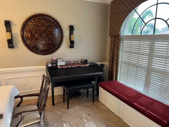 Piano and Games in Dining Room