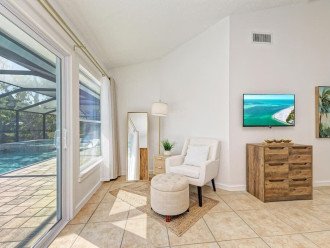 Primary bedroom seating area with fabulous pool views