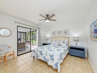 The 2nd bedroom has a queen-sized bed and direct access to the pool.