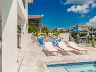 Lounge chairs by the pool.