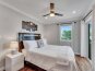 Drift into dreams with a view of the ocean's embrace. Wake up refreshed in our queen bedroom, where stunning ocean vistas meet modern comfort, complete with a smart TV for leisurely moments. Experience serenity on every level.