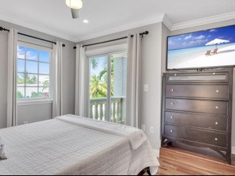 Drift into dreams with a view of the ocean's embrace. Wake up refreshed in our queen bedroom, where stunning ocean vistas meet modern comfort, complete with a smart TV for leisurely moments. Experience serenity on every level.