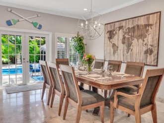 The dining room features a large table with seating for the entire family.