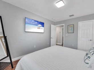 The third bedroom features a king bed and smart TV.