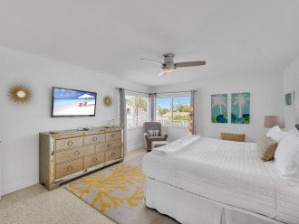The second bedroom is a spacious king room, adorned with a plush bed and a smart TV for your ultimate relaxation.