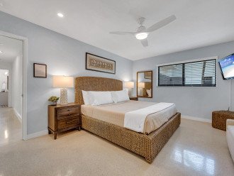 The spacious primary bedroom boasts a king size bed, en-suite bathroom and a smart TV.