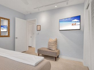 The second bedroom boasts a king size bed and a smart TV.