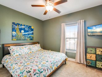 Guest bedroom with King bed, flat screen smart TV and en-suite bathroom