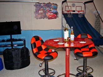 Gather around and watch the action in the game room