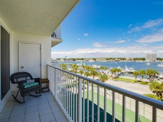 Oversized balcony area with room for everyone to enjoy the breezes and harbor vi