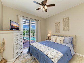Guest bedroom with direct pool access and large closet