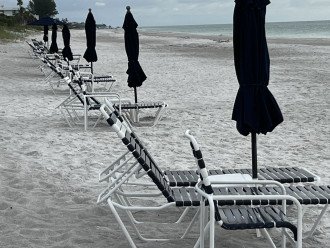 Umbrella and beach chairs waiting for you