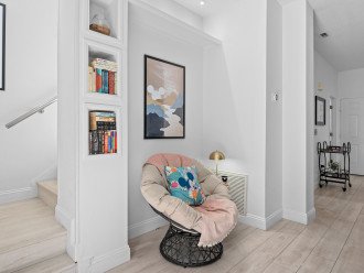 Cozy up with a good book in our reading nook featuring a Papasan chair.