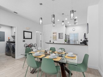 From the dining area, take in the harmonious blend of the stylish kitchen and the convenient laundry area, where the comfort of home meets practicality in one glance.