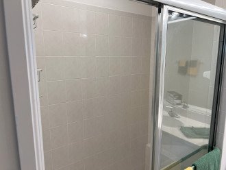 Large walk in shower with bench in the master bath