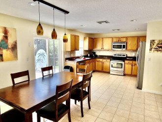 Spacious kitchen dining area very convenient for large family cooking.
