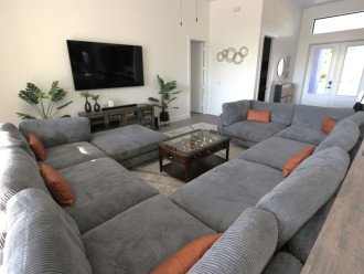 Oversized and super comfy couch (afternoon nap anyone?). 75" TV, Bluetooth soundbar and lots of board games in the media console!