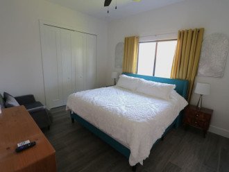 3rd King sized bedroom, 40" backlit TV, Touch lamps with USB charging ports, plenty of storage space with the end tables, dresser and luggage racks, private bathroom and an oversized chair that converts into a twin bed if needed.