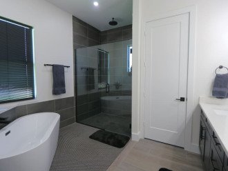 Master bathroom with private toilet room, dual shower heads and soaking bathtub!