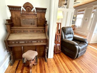 All Hardwood Floors - Antique Organ and Leather Recliner