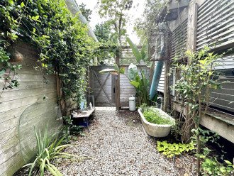 Gate to Guesthouse which is rented separately if you have more Guests - Upstairs Palm View 3 BD 2 BA Sleeps 9 and First floor Secret Garden 1 BD 1.5 BA Sleeps 5