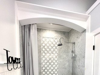 Arched Marble Tub Alcove with high ceiling
