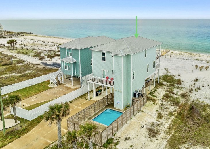 Aerial view of the home with pool and gulf-front location. Secluded part of Cape