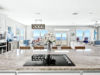 Open-concept kitchen, dining and living room with wall to wall gulf views!