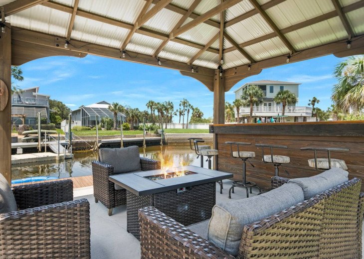 Gazebo with fire pit table and bar