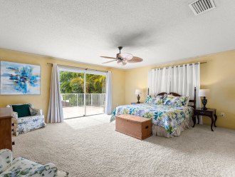 Very spacious master bedroom with view of water