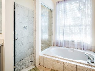 Recently renovated tiled walk in shower and large garden tub