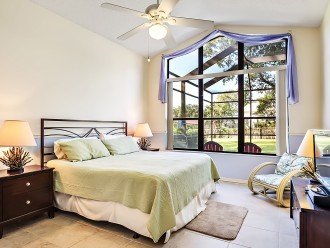 Master Bedroom by the pool with flat screen TV