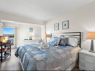 Comfortable king bed in the master suite with water view