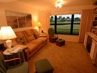 Living room looks out at lake and the 10th hole.