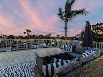 Upper deck below the palms offers canal views and vistas of wetlands/sunsets.