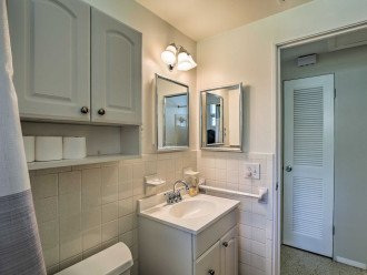 The bathroom is set just steps down the hall for your convenience.