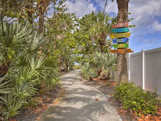 The path leads to the white sand beach.