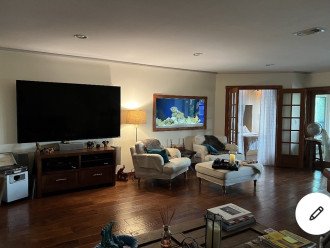 Living room with 81 inch TV and built in Aquarium