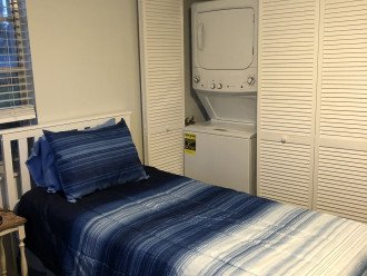 Bedroom 2 showing stackable washer/dryer
